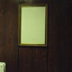 Holder where a sign, giving information, such as prizes or offers, would've been placed.