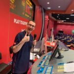 The caller at the Hengrove Buzz Bingo gives a thumbs up.