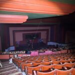 A wide view of the hall in a dilapidated state