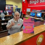 A staff member on Book Sales gives a thumbs up.