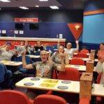 Some happy players and a view of the book sales desk at Grantham Buzz Bingo.