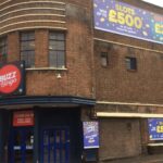 A view of the exterior of the club with the Buzz Bingo branding.