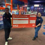 Staff celebrate a big money winner with the big cheque at Stratford Buzz Bingo.